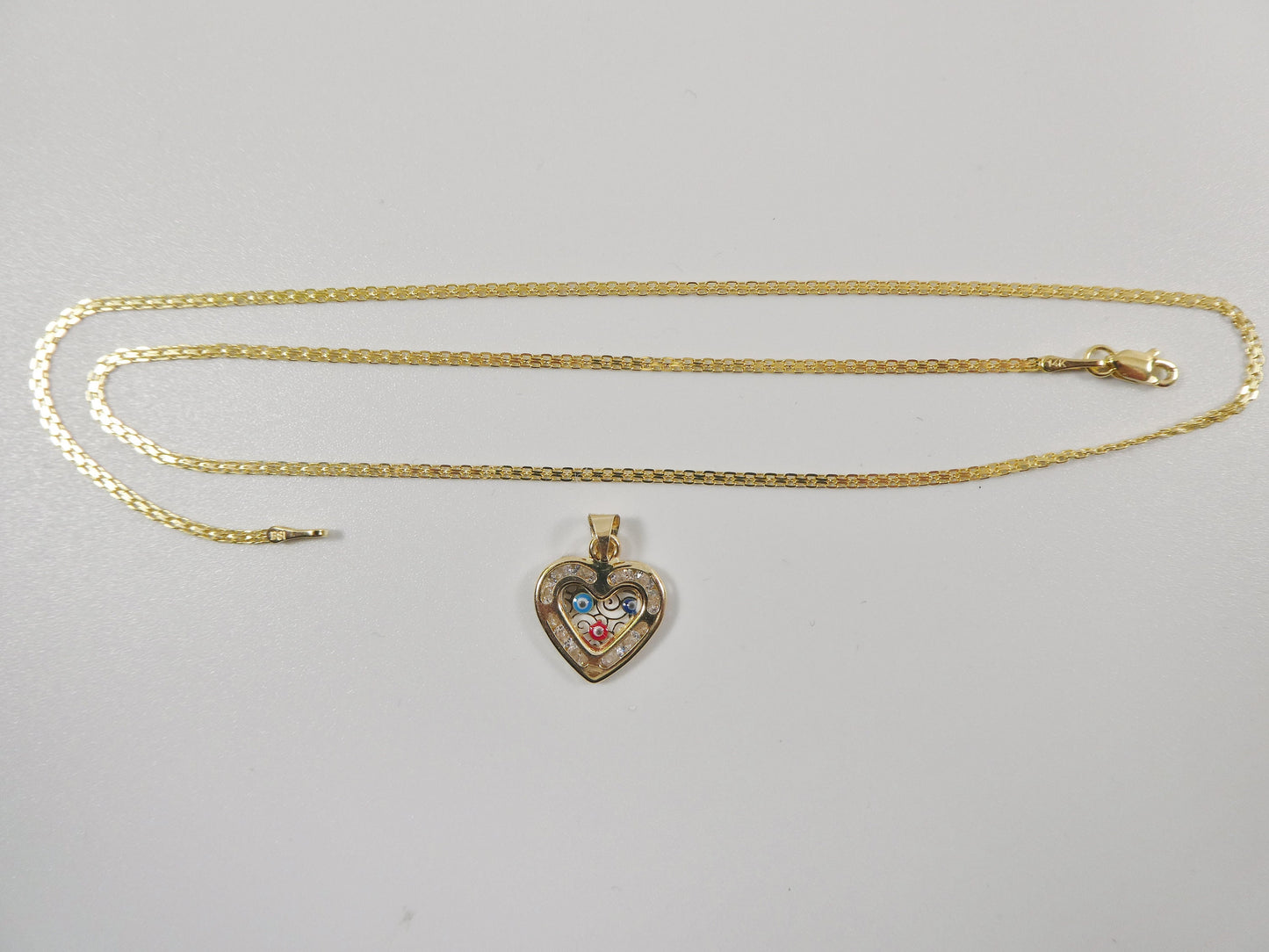 real 14k solid yellow gold 16 inch Bismarck chain and evil eye heart pendent