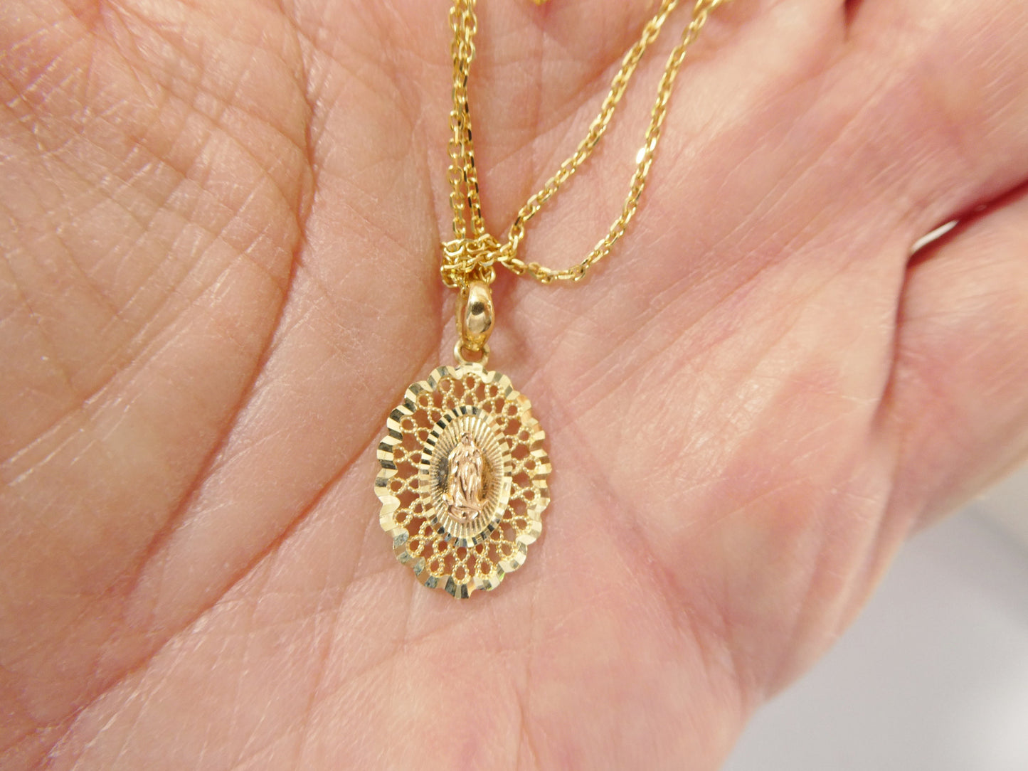 10k real solid yellow gold Guadalupe pendent and 18 inch cable necklace
