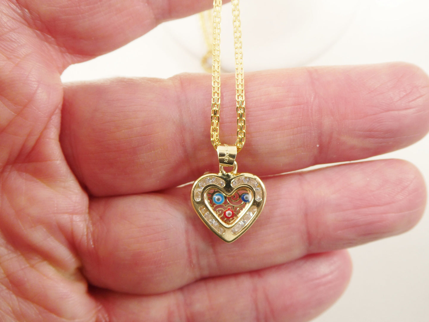 real 14k solid yellow gold 16 inch Bismarck chain and evil eye heart pendent