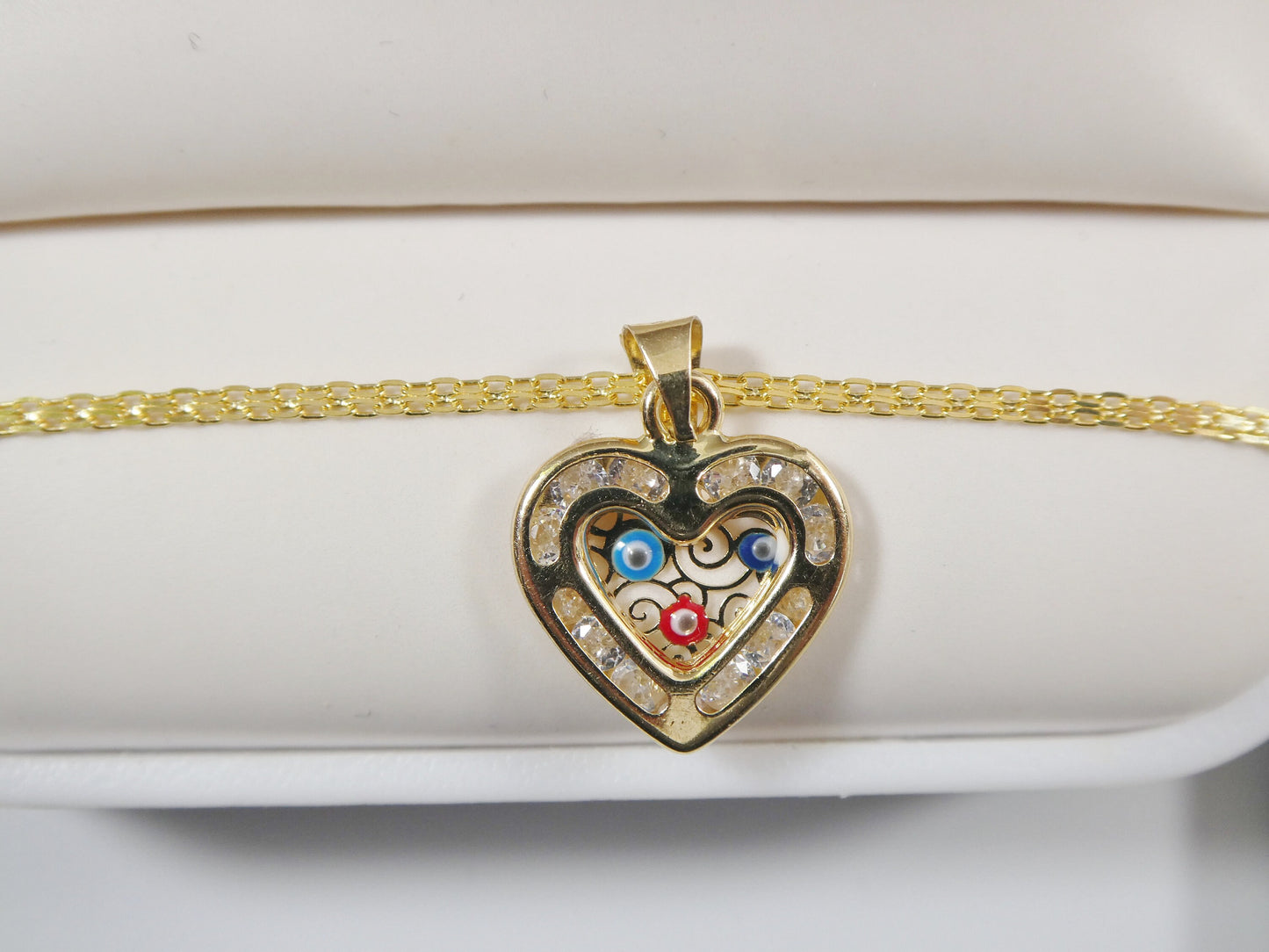 real 14k solid yellow gold 16 inch Bismarck chain and evil eye heart pendent