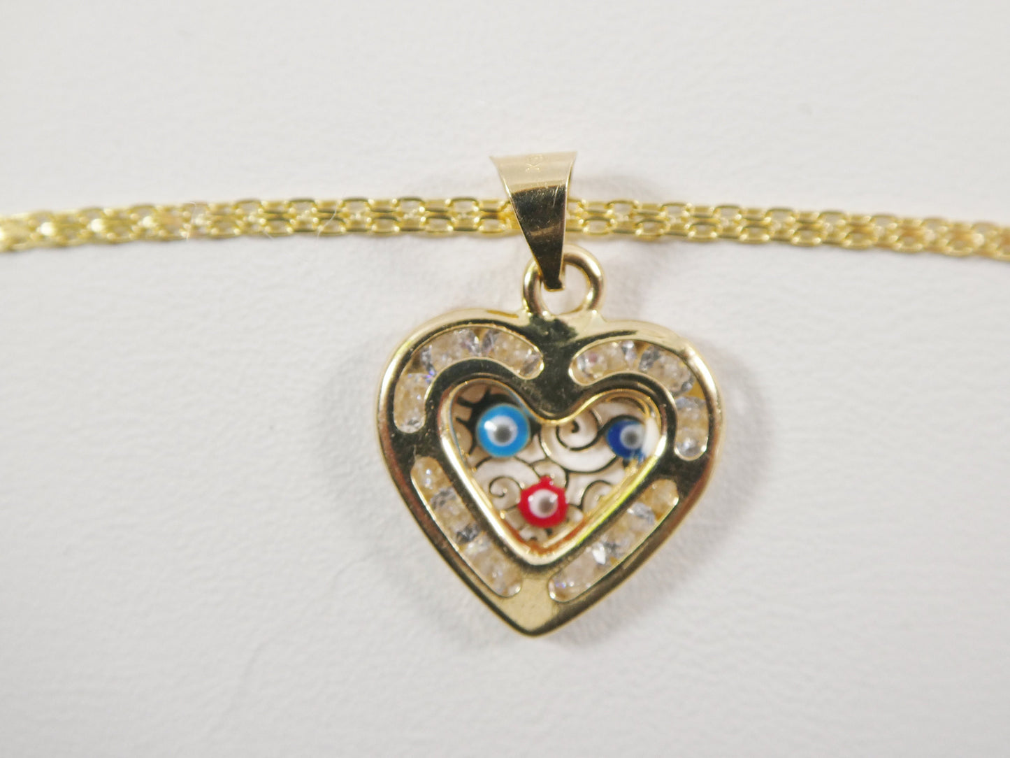 real 14k solid yellow gold 16 inch Bismarck chain and evil eye heart pendent