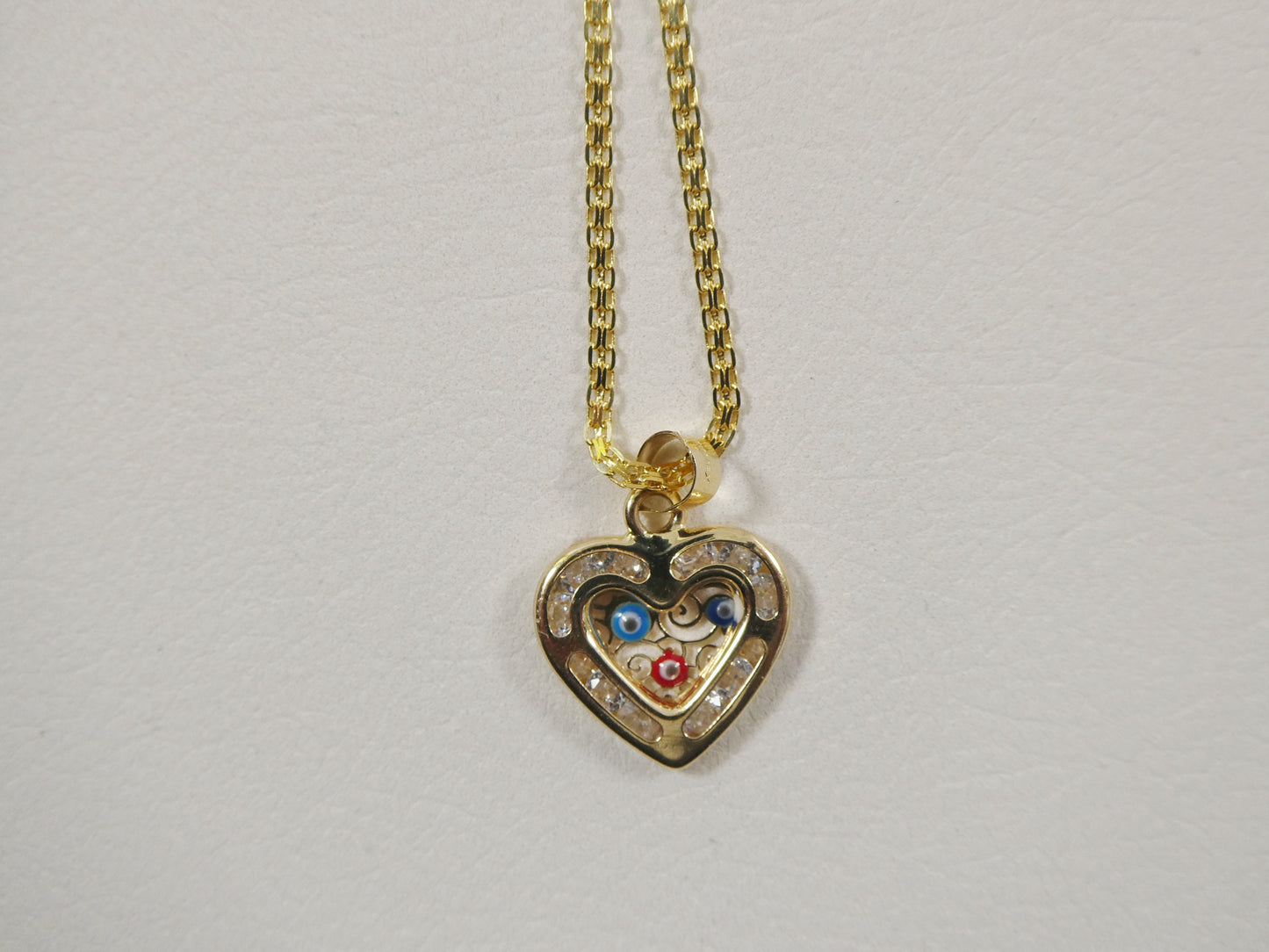 real 14k solid yellow gold 16 inch Bismarck chain and evil eye heart pendent