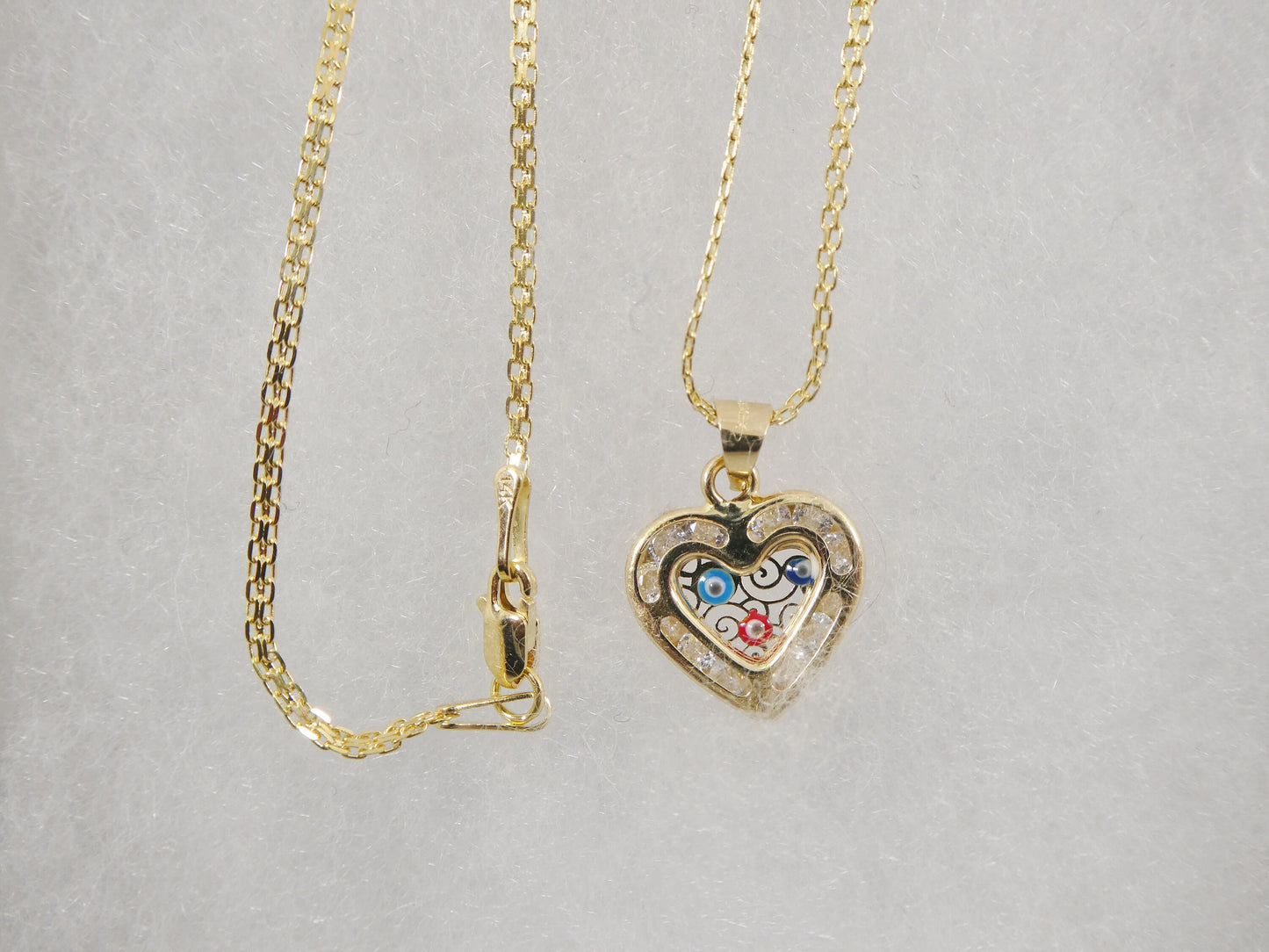 real 14k solid yellow gold 16 inch Bismarck chain and evil eye heart pendent
