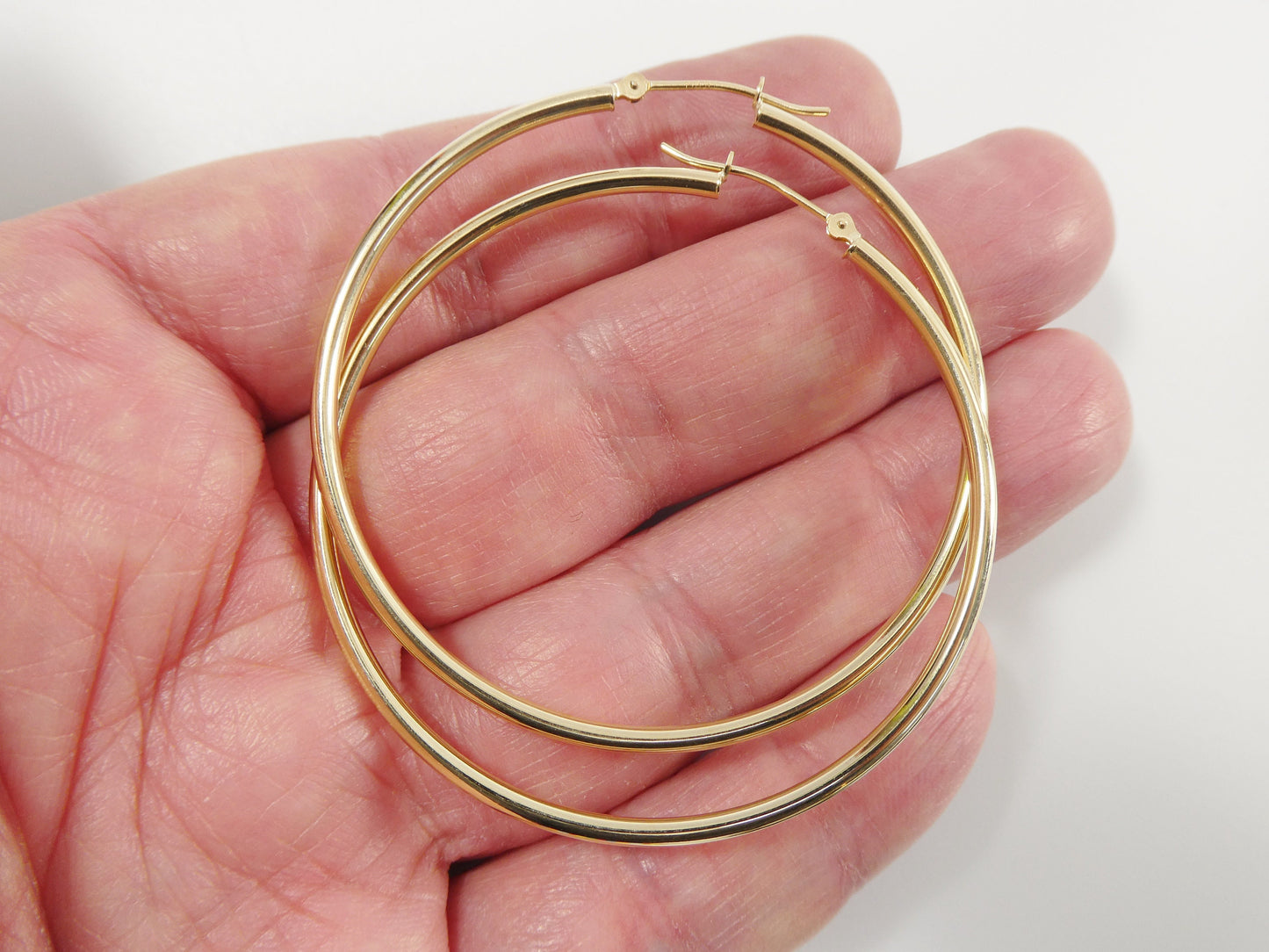 14K real solid yellow gold 2mm / 50mm round hoop earring snap closure high polish finish