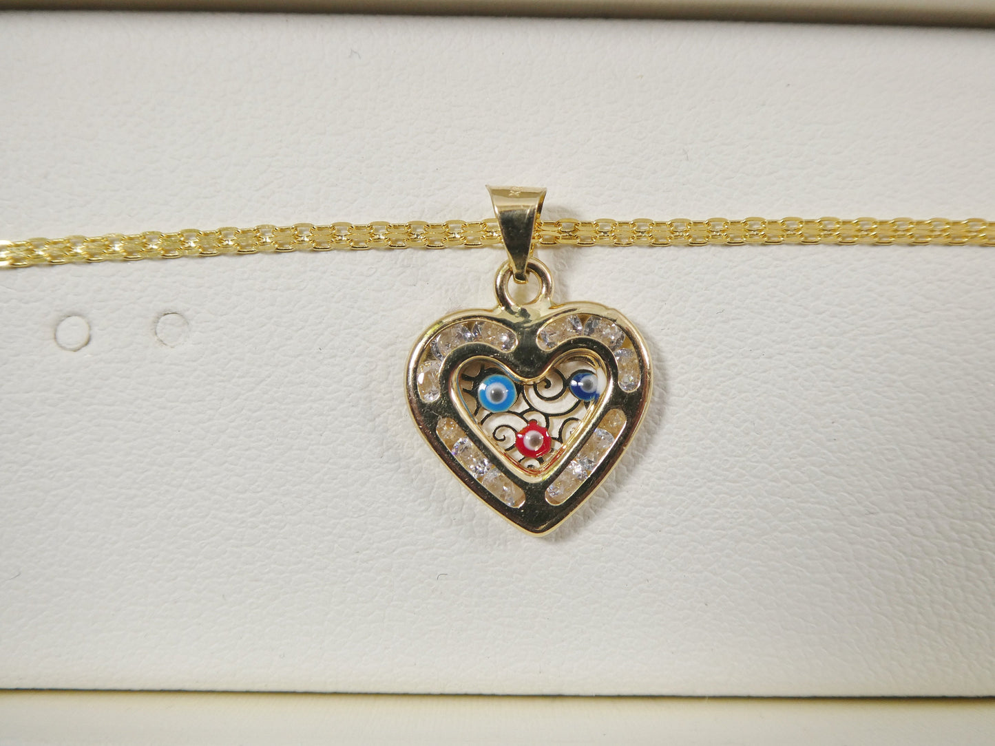 real 14k solid yellow gold 16 inch Bismarck chain and evil eye heart pendent