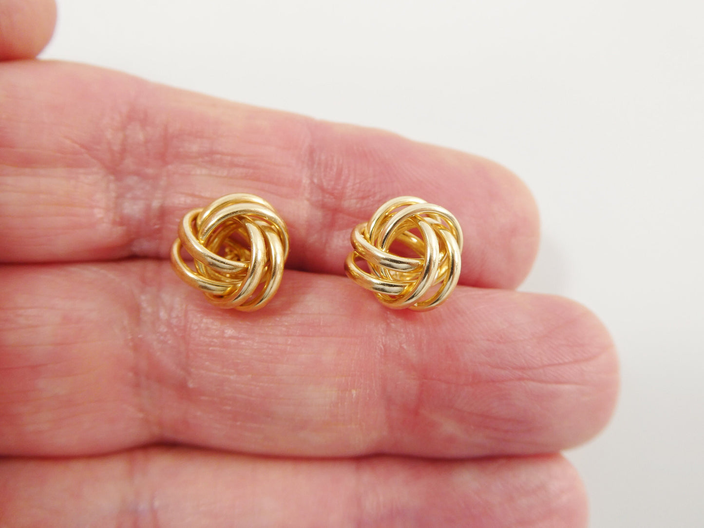 real 10k solid yellow gold push post medium size love knot stud earrings